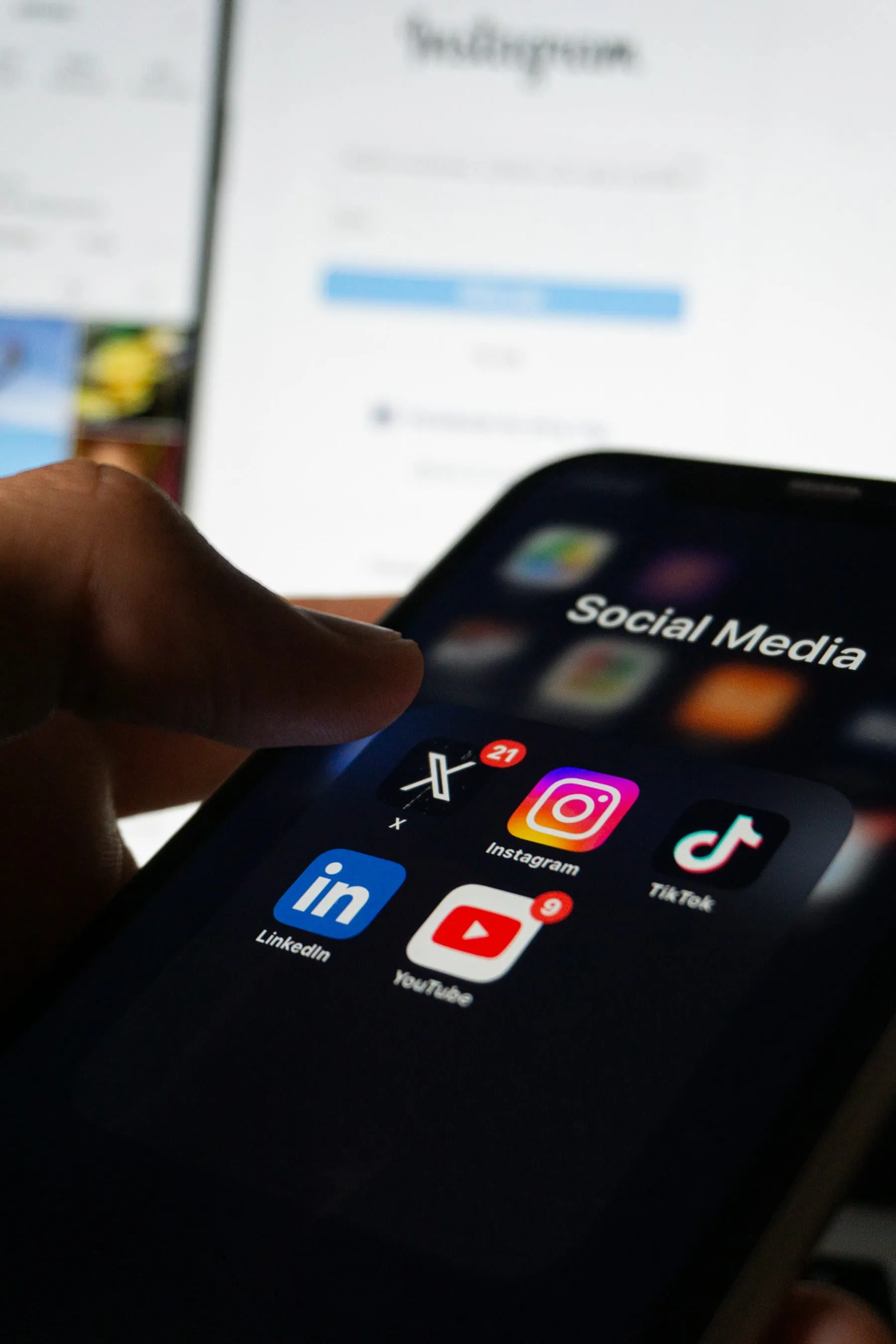 A phone screen showing a social media folder with colorful app icons